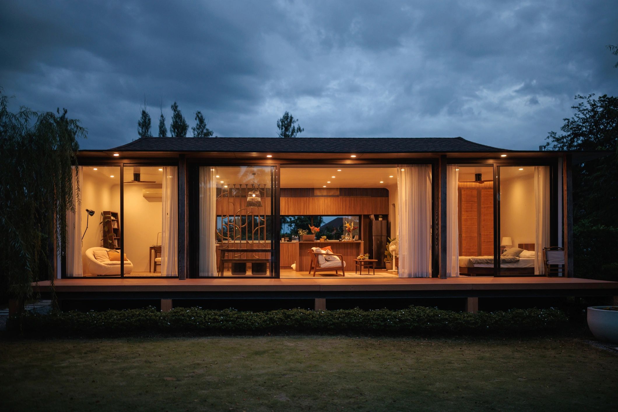 Modern backyard ADU-style home exterior at dusk